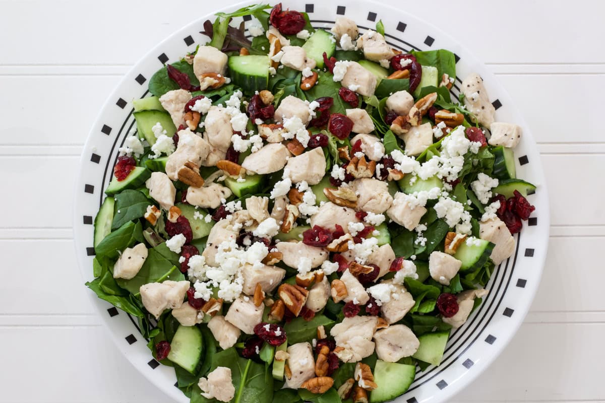 The dried cranberries, pecans, and goat cheese added to the salad.
