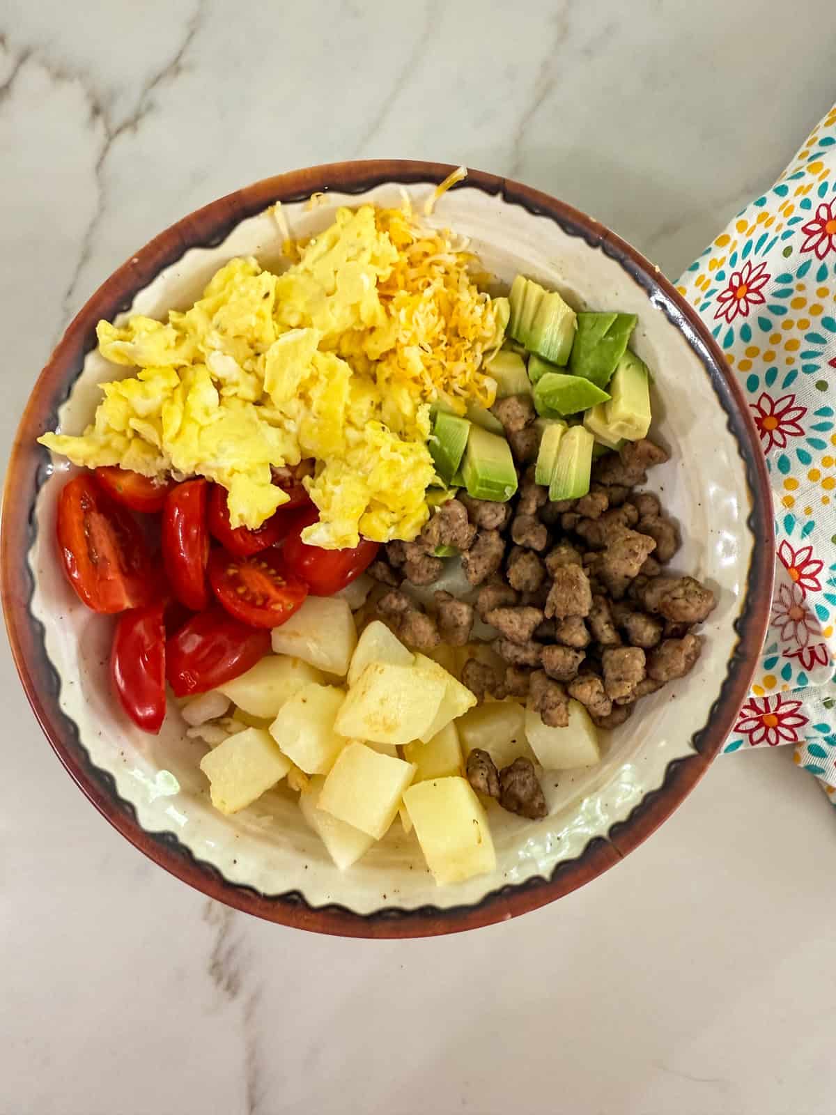 All of the components of the Healthy Breakfast Burrito Bowls in a bowl.