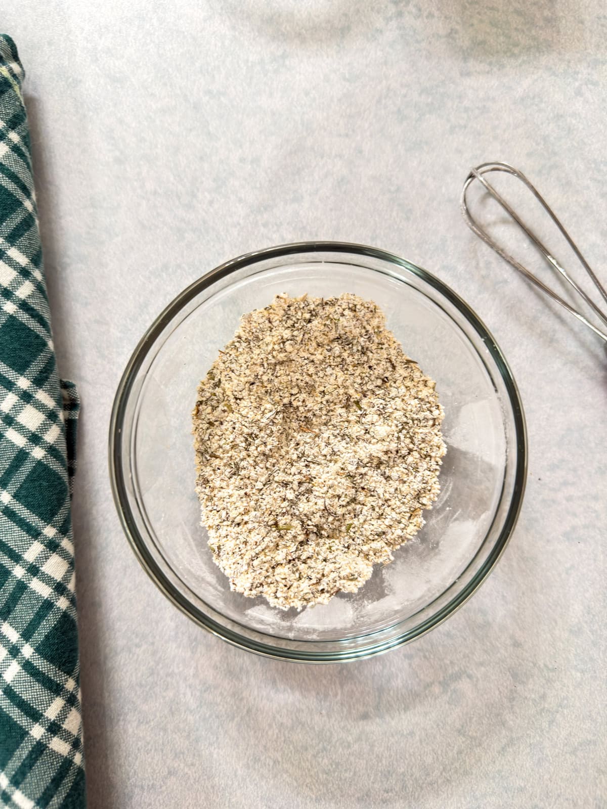 All of the ingredients for the seasoning packet mixed together in a small glass bowl