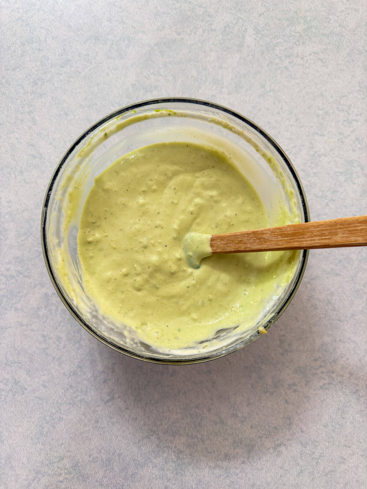 The avocado lime ranch dipping sauce mixed together in a small bowl.
